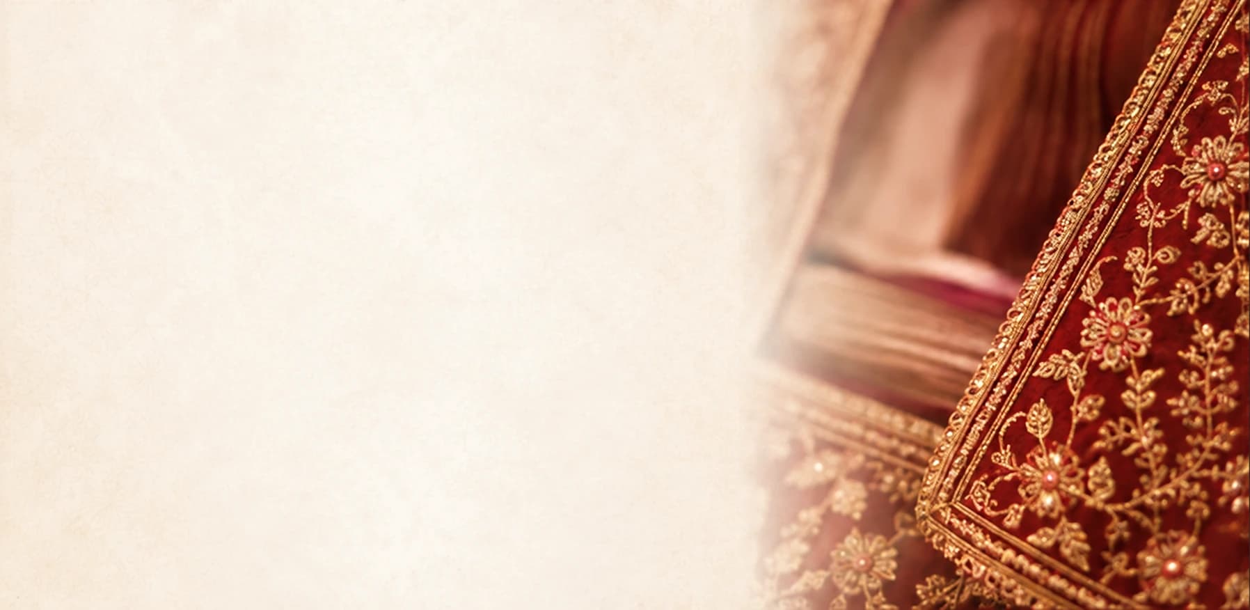 Intricate maroon and gold zari embroidery on handcrafted fabric